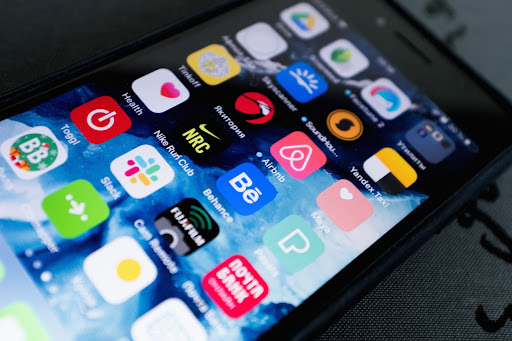 Phone screen displaying a multitude of apps in a grid pattern.